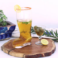 Chilled beer poured in a unique shoe shaped beer glass
