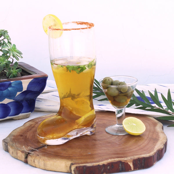 Chilled beer poured in a unique shoe shaped beer glass 