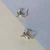 A contemporary yet traditional set of silver kundal earrings. They are both bold and stylish!